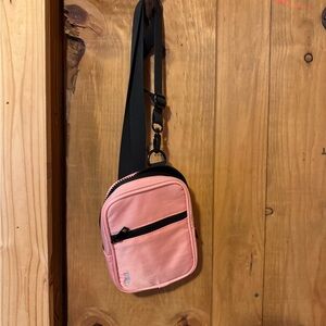 Compact Pink and Black Crossbody Bag with Adjustable Strap